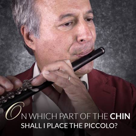 On which part of the chin shall i place the piccolo?